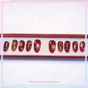 Red Christmas press on nails with snowflakes